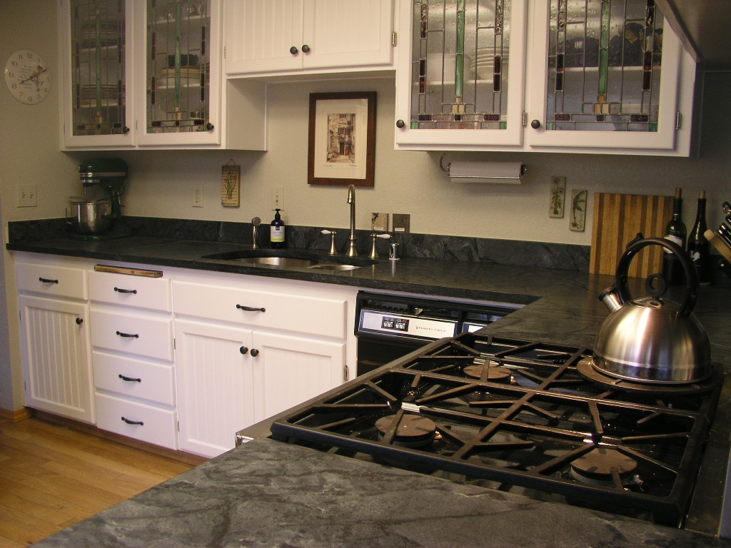 Black Marble Countertop With Black Stove And Silver Wastafel On